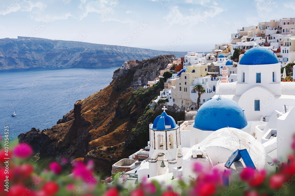 Blue domes and bell tower of churches in Oia, Santorini, Greece