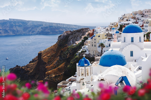 Blue domes and bell tower of churches in Oia, Santorini, Greece