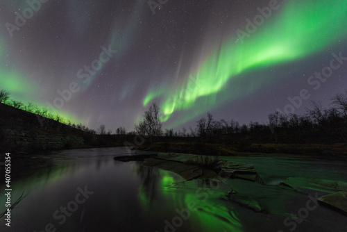 Aurora over river in Alta
