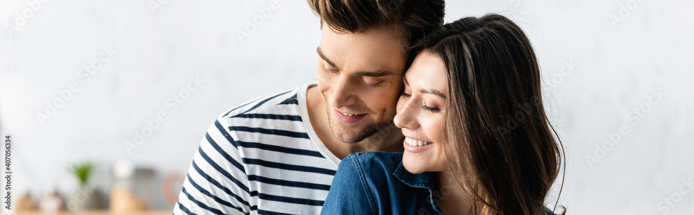 joyful man and woman smiling and looking away, banner