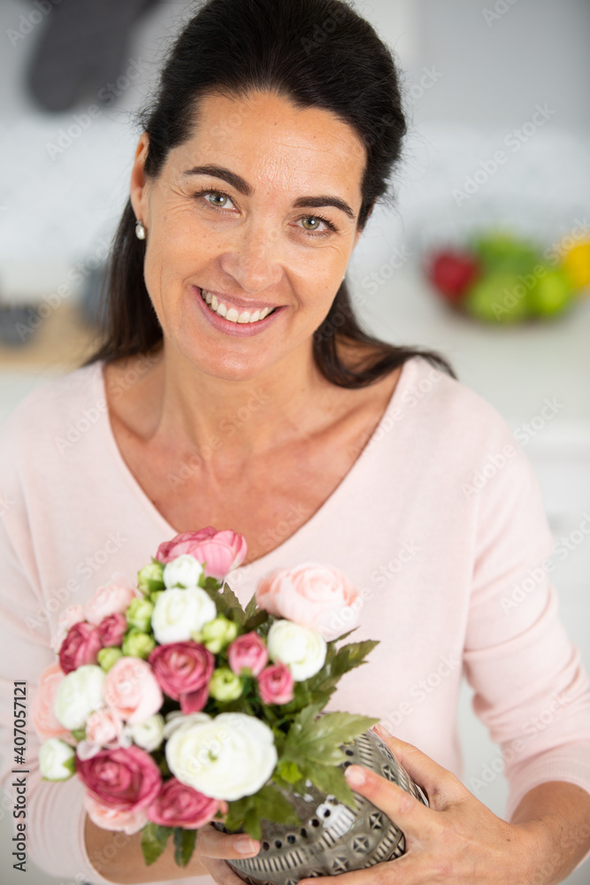cute happy woman holding flowers cute happy woman holding flowers