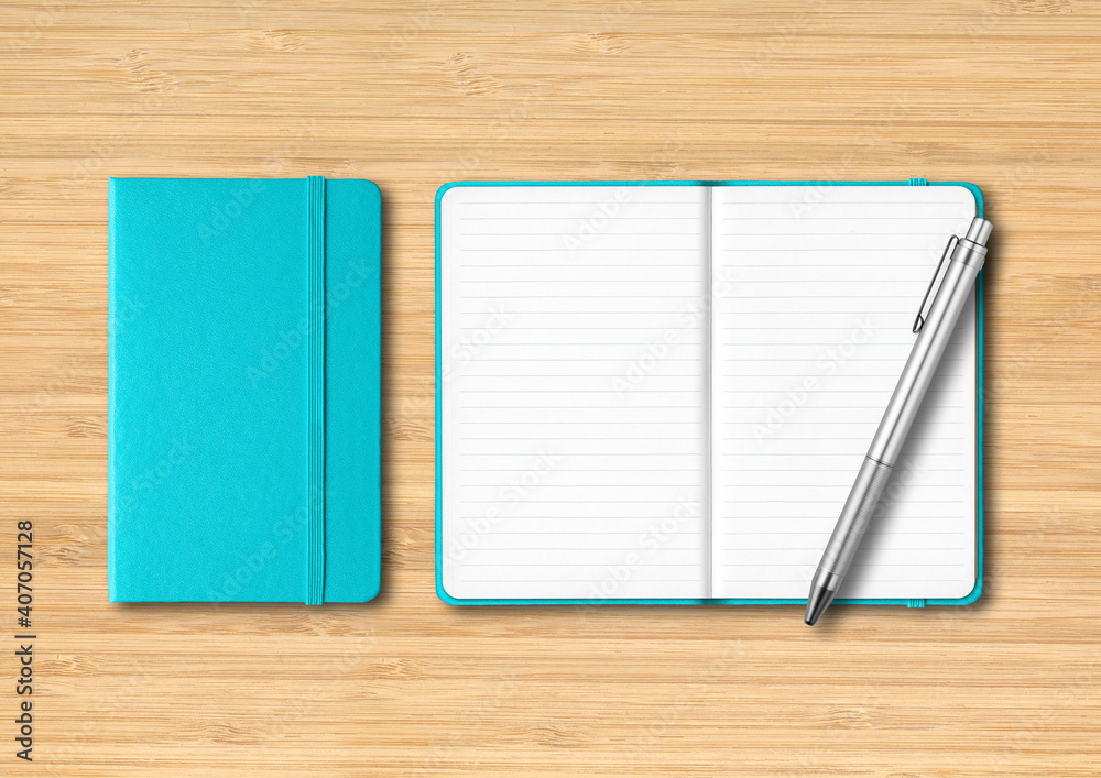 Aqua blue closed and open lined notebooks with a pen on wooden background Aqua blue closed and open lined notebooks with a pen on wooden background
