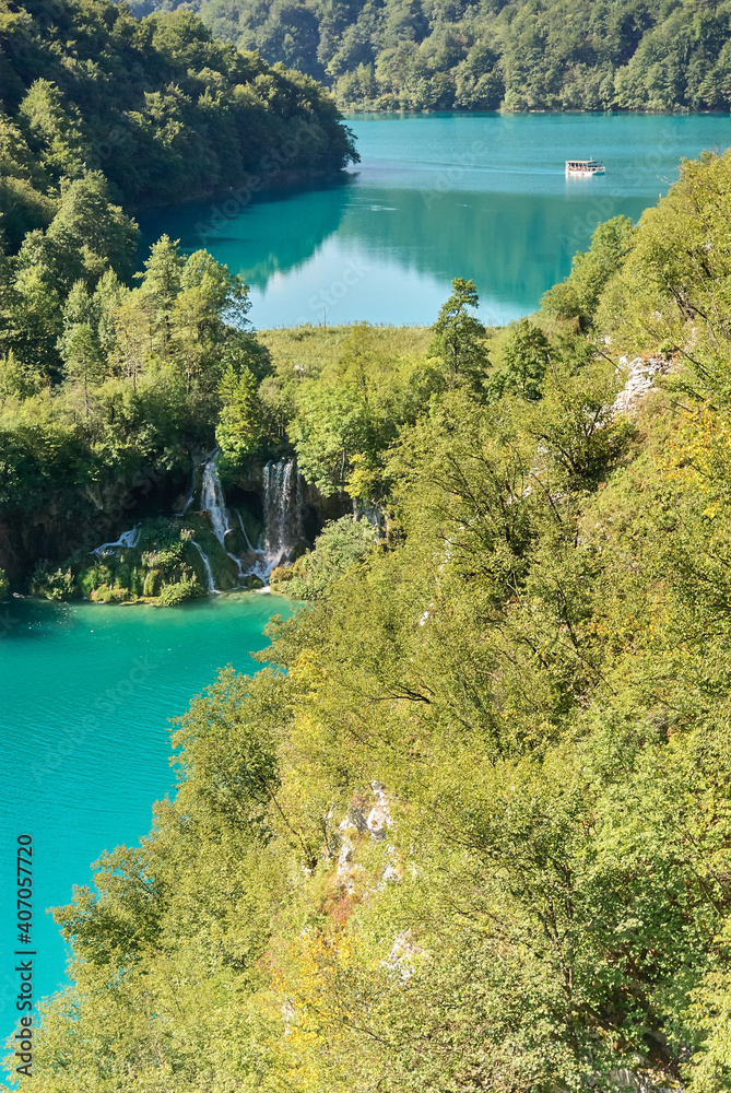 view of the blue lakes and green trees in Plitvice lakes in Croatia