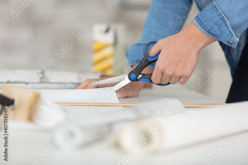 close up woman using scissors