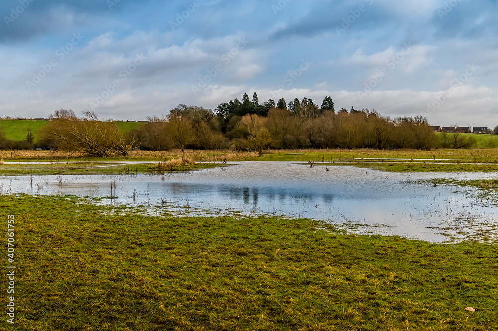A view across the River Welland flood water looking towards Market Harborough, UK in winter