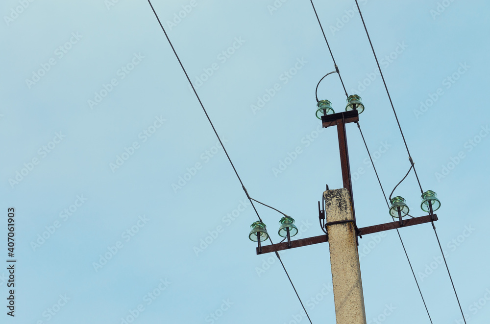 Power line on a concrete column with insulators Power line on a concrete column with insulators