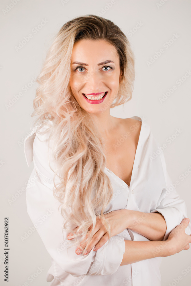 charming long-haired woman in white shirt charming long-haired woman in white shirt