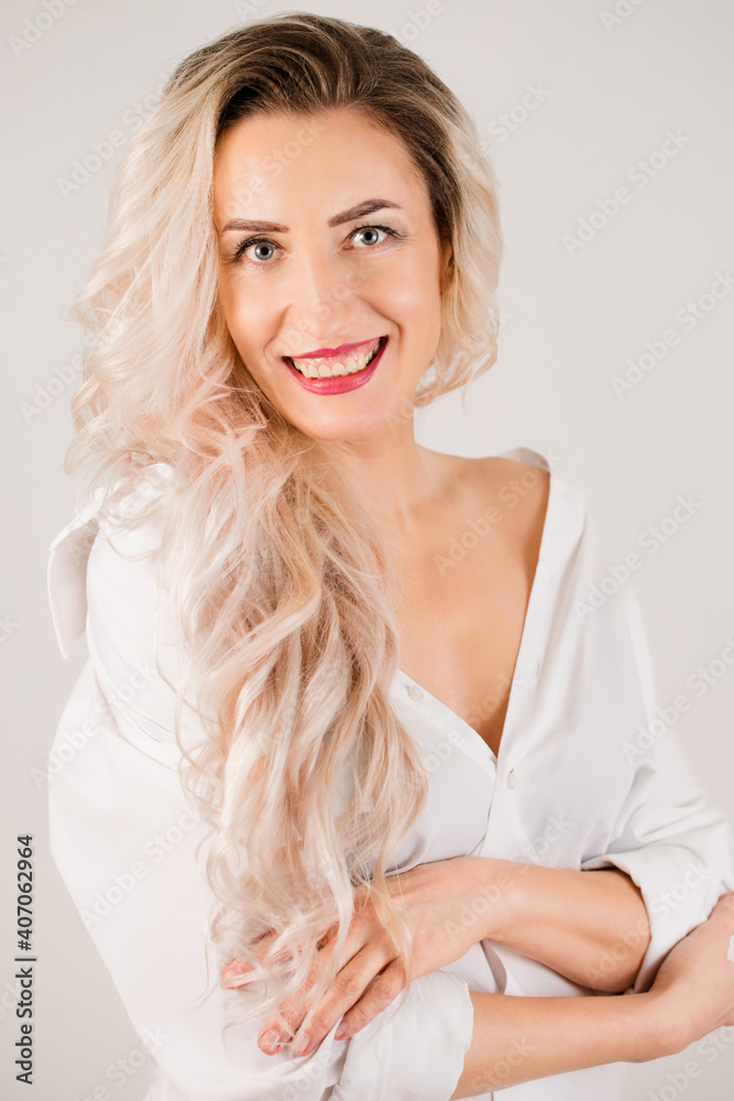 tender long-haired woman in white shirt