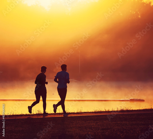 Silhouette of running man at sunrise