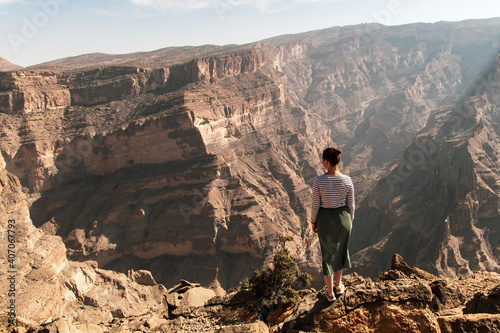 hiker in a canyon in Jebel Akhdar mountains, Oman