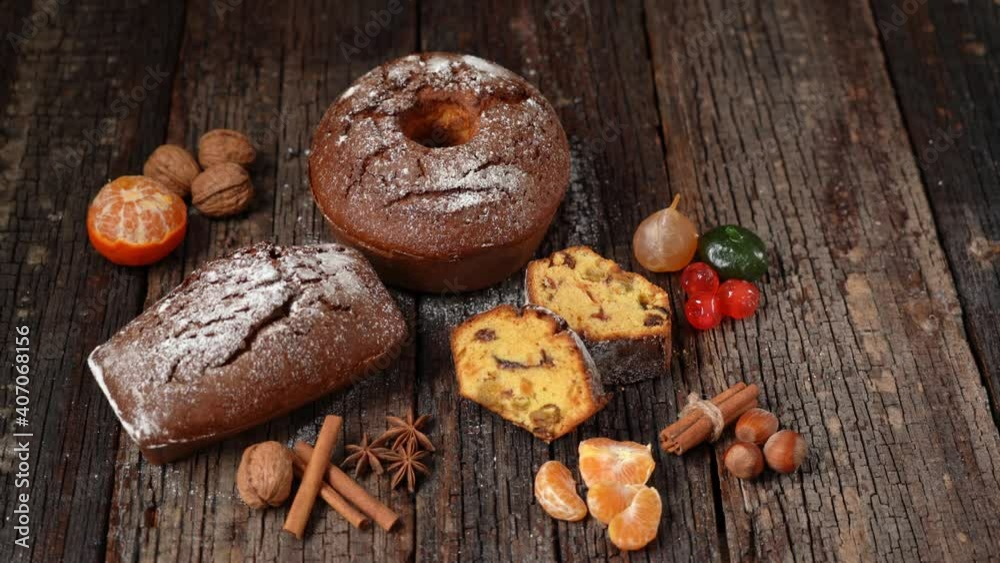 Christmas composition of dried fruits and stollen, with tangerine, on a wooden textured table, with spices. At Christmas. Christmas composition of dried fruits and stollen, with tangerine, on a wooden textured table, with spices. At Christmas.