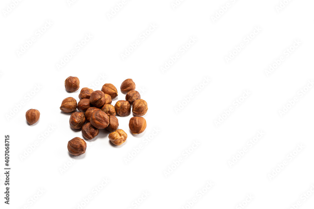 Dried hazelnuts on a white background, vegetarian food Dried hazelnuts on a white background, vegetarian food