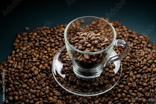 a cup of coffee among roasted coffee beans