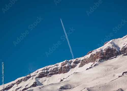 Plane Over Mountainside
