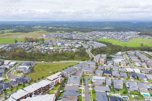 Photography Aerial view of grey roofed houses in the suburbs