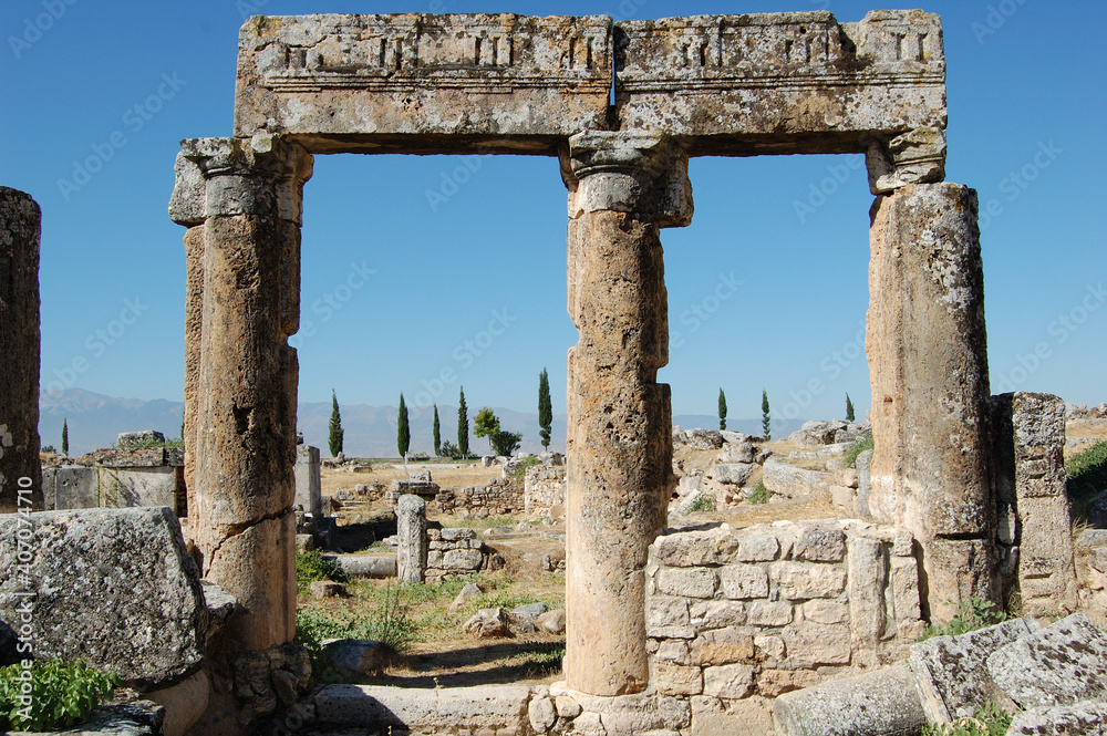 Ancient Roman ruins of Hierapolis (Anatolia, Turkey). Next to the natural hot springs of Pamukkale.
