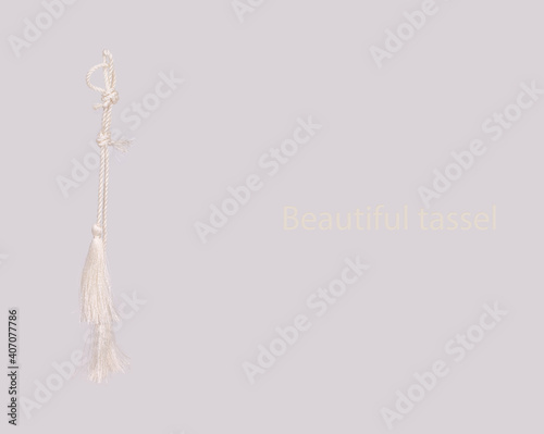 Concept poster: White silk tassels isolated on white background for creating graphic concepts.