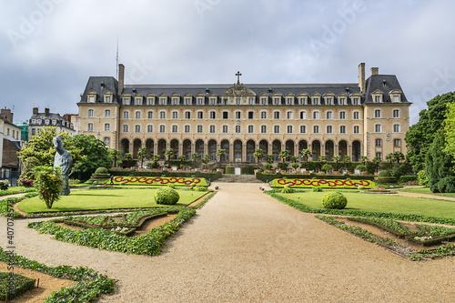 Public formal garden Saint-Georges (Jardin Saint-Georges) and Saint George Palace (Palais Saint-Georges) - historic building, formerly an abbey residence, it built in 1670. Rennes. France.