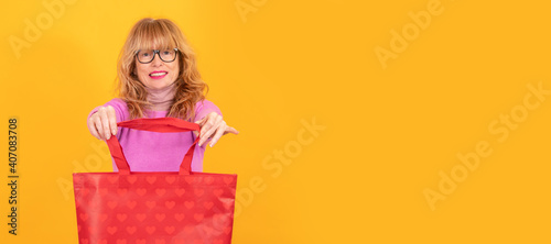 woman with shopping bag with hearts isolated