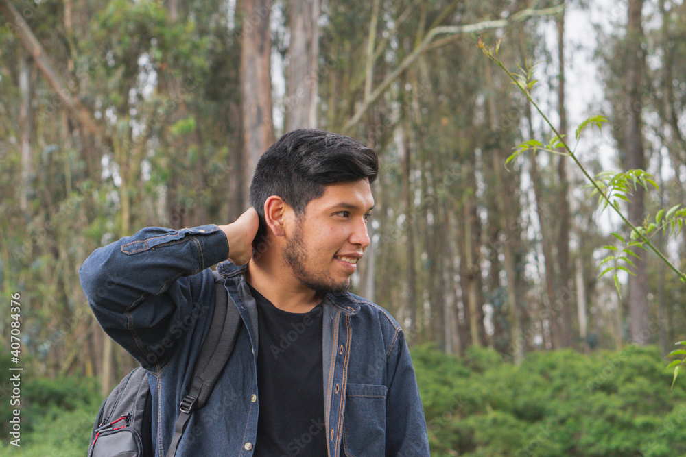 Young man walking in the woods. Young man walking in the woods.