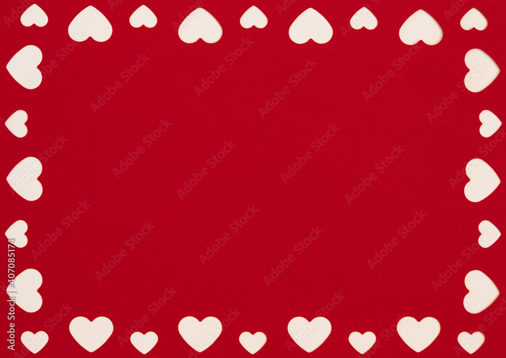 Valentine's day frame. White hearts on a red background. Love concept. Space for text, top view.
