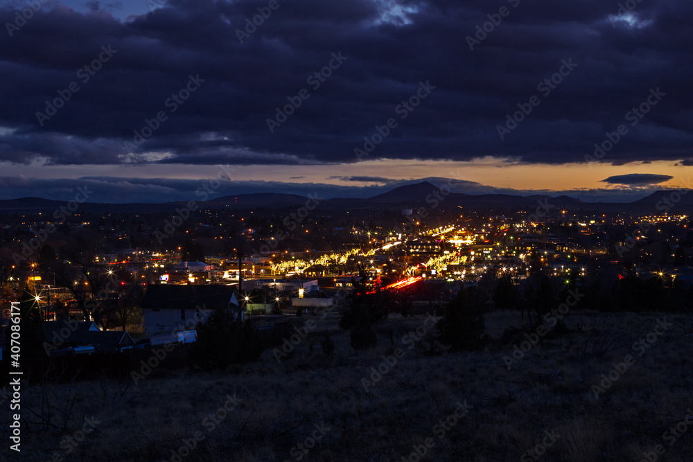 View at cityscape of Madras, Oregon. Cityscape illuminated in dusk