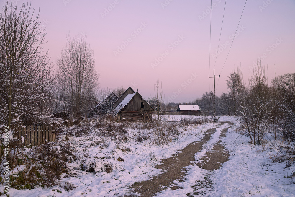 Rural winter landscape in the evening time.