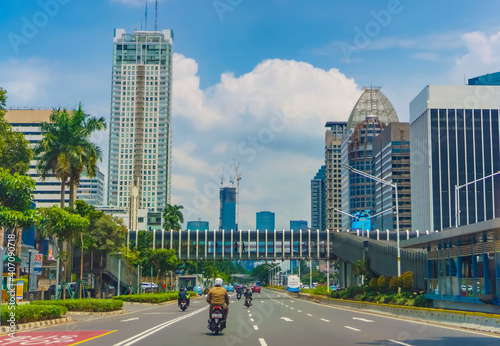 Jakarta city landscape with moderate traffic during the day. Vibrant and futuristic city	