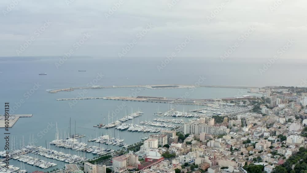 Marina dron 4K video. Aerial view of a port with boats and ships standing on the shores of the Mediterranean Sea in Palma on the island of Mallorca with historic buildings on the waterfront Marina dron 4K video. Aerial view of a port with boats and ships standing on the shores of the Mediterranean Sea in Palma on the island of Mallorca with historic buildings on the waterfront