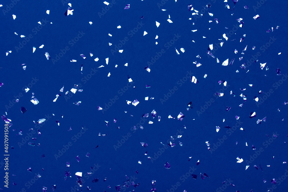 Beautiful festive blue background with metallic shaped confetti. Holiday decoration concept. Beautiful festive blue background with metallic shaped confetti. Holiday decoration concept.