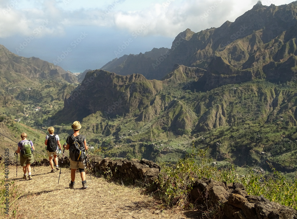 Obraz premium Small hiking group, Cape Verde, Santo Antao island, dramatic landscape.