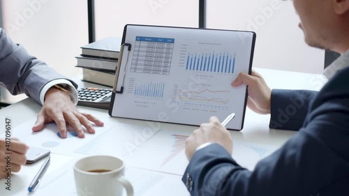 Businessman meeting and working with financial report, talking about business plan for investment, finance analysis concept photo