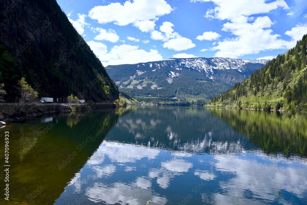 reflection of clouds on the water at three gap junction in the Canadian rockies reflection of clouds on the water at three gap junction in the Canadian rockies