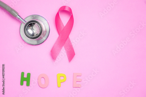 breast cancer awareness ribbon on pink background