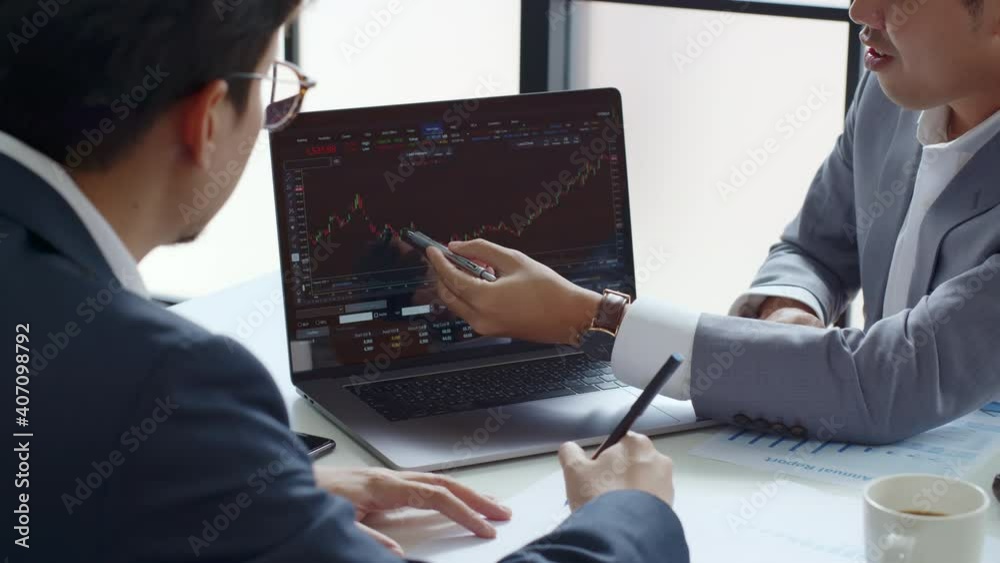 Businessman talking about investment stock market and graph from computer laptop with broker trader, giving money plan management and analysis