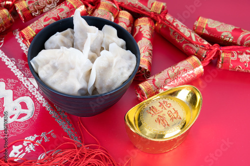 New year's decorations and a bowl of dumplings photo