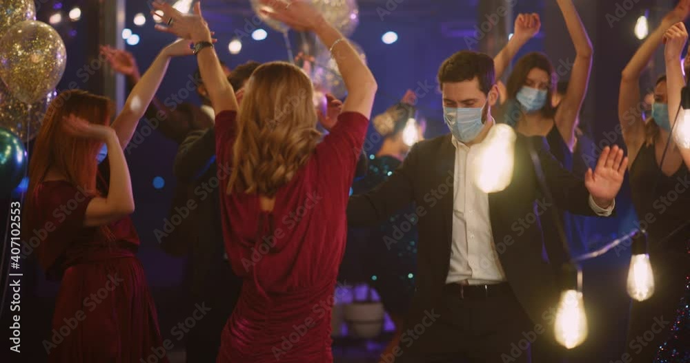 Diverse Multi-Race Company of Friendly Happy Young People Coworkers Celebrating Company Victory Success Dancing in Beautiful Hall Together. Quarantine Concept. Diverse Multi-Race Company of Friendly Happy Young People Coworkers Celebrating Company Victory Success Dancing in Beautiful Hall Together. Quarantine Concept.