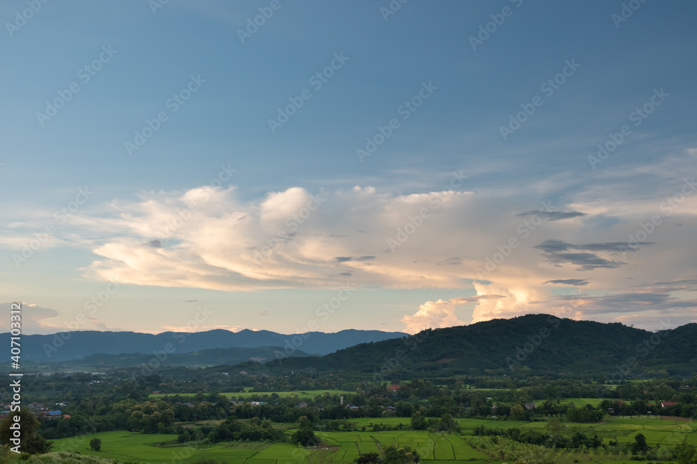 Fototapeta premium The white clouds have a strange shape and moutain.