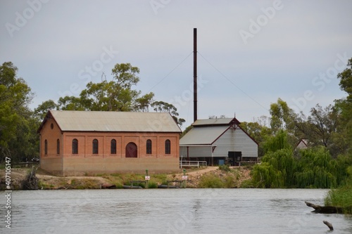 Old and new pumphouse on the riverbank