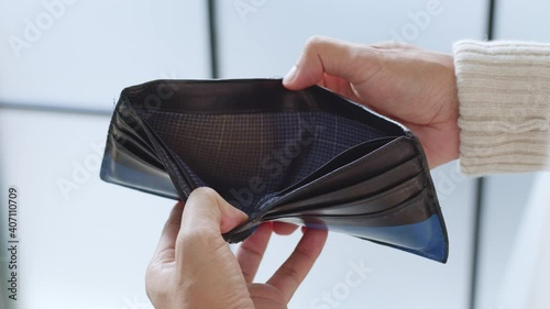 Unemployment poor man open empty wallet, bankrupt and no money concept photo