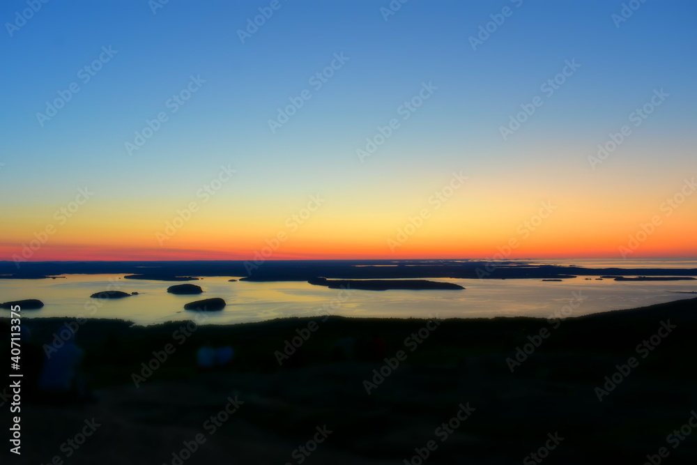  A beautiful sunrise over Acadia National Park's coastline as seen from Cadillac Mountain.