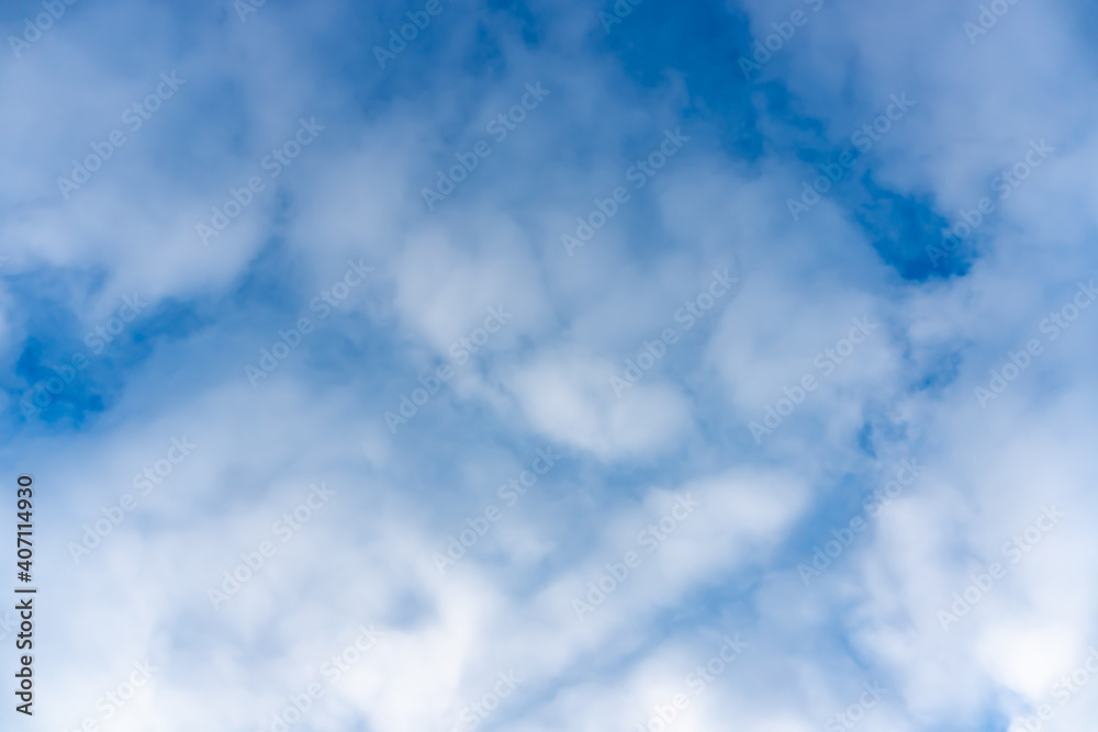White clouds on clear sky background, spring sunny blue sky with white clouds