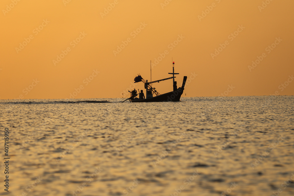 A fishing boat going out to fish in the early morning.