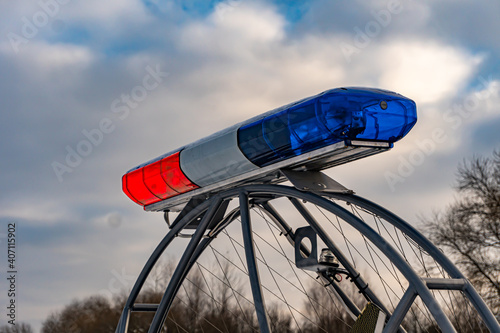 Police flashers on a snowmobile close up, police all-terrain vehicle in winter, air-cushion boat