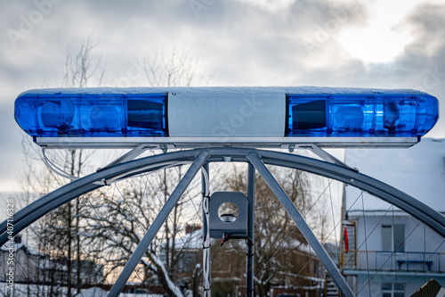 Police flashers on a snowmobile close up, police all-terrain vehicle in winter, air-cushion boat