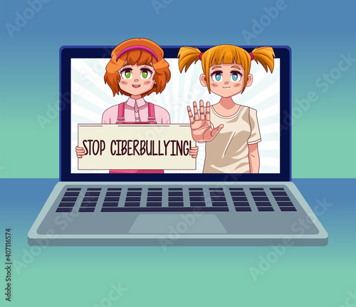 laptop with teenagers girls couple lifting stop cyber bullying banner