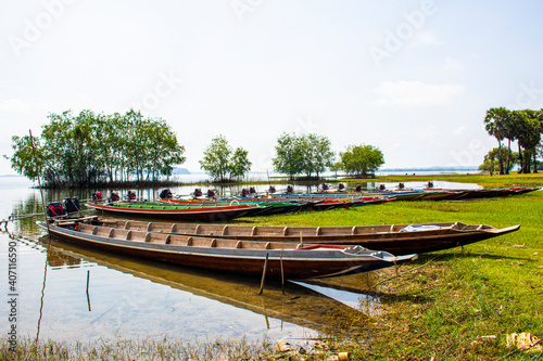 Long-tailed boats moored by the water