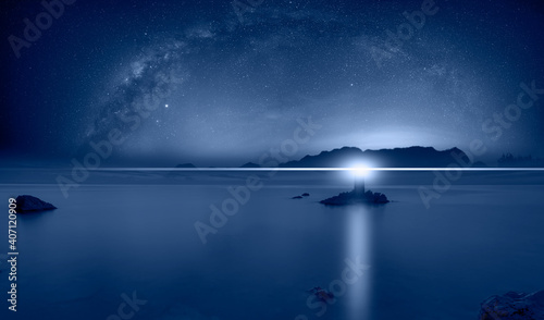 Beautiful night landscape with lighthouse at dark night, Milky way galaxy in the background