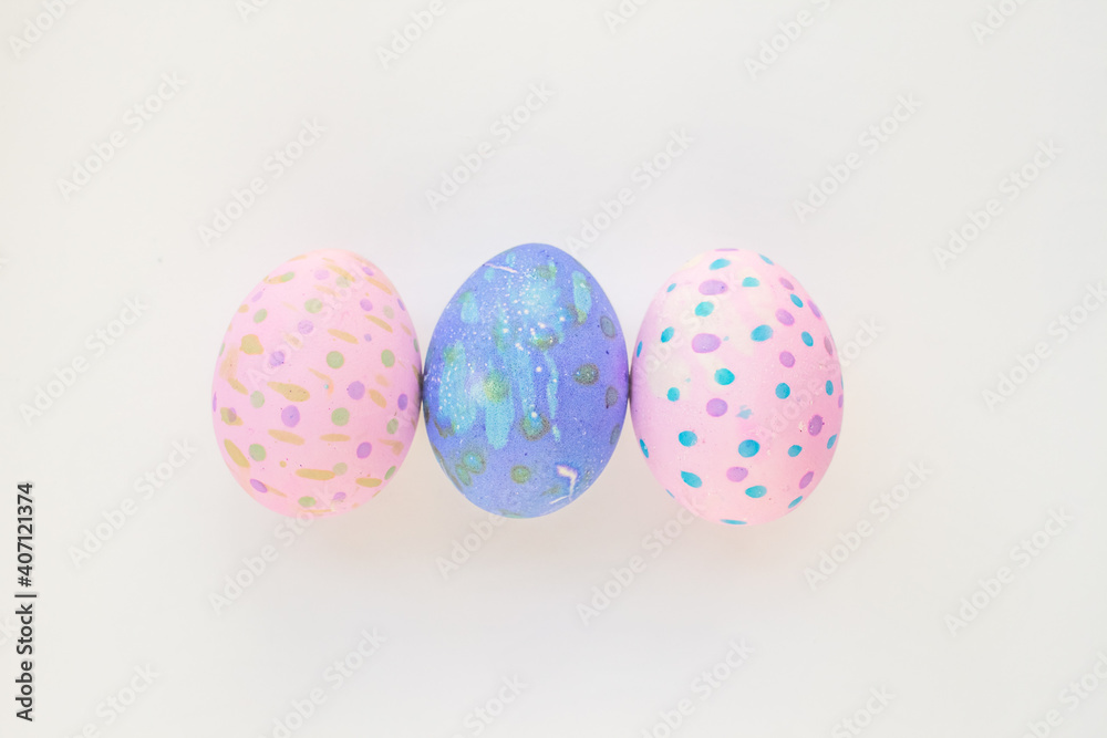Set of colorful hand-painted Easter eggs. Bright children's drawings on Easter eggs top view on a white background. Happy Easter holiday and fun for children Set of colorful hand-painted Easter eggs. Bright children's drawings on Easter eggs top view on a white background. Happy Easter holiday and fun for children