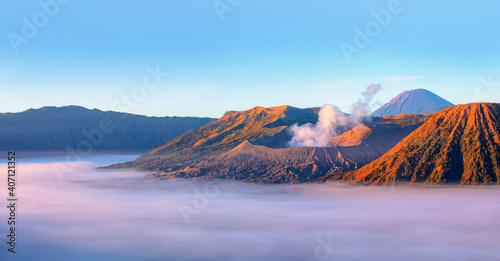 Beautiful landscape with Mount Bromo volcano viewpoint in Bromo Tengger Semeru National Park SEMERU VOLCANO in the background at sunrise - Semeru  Indonesia.